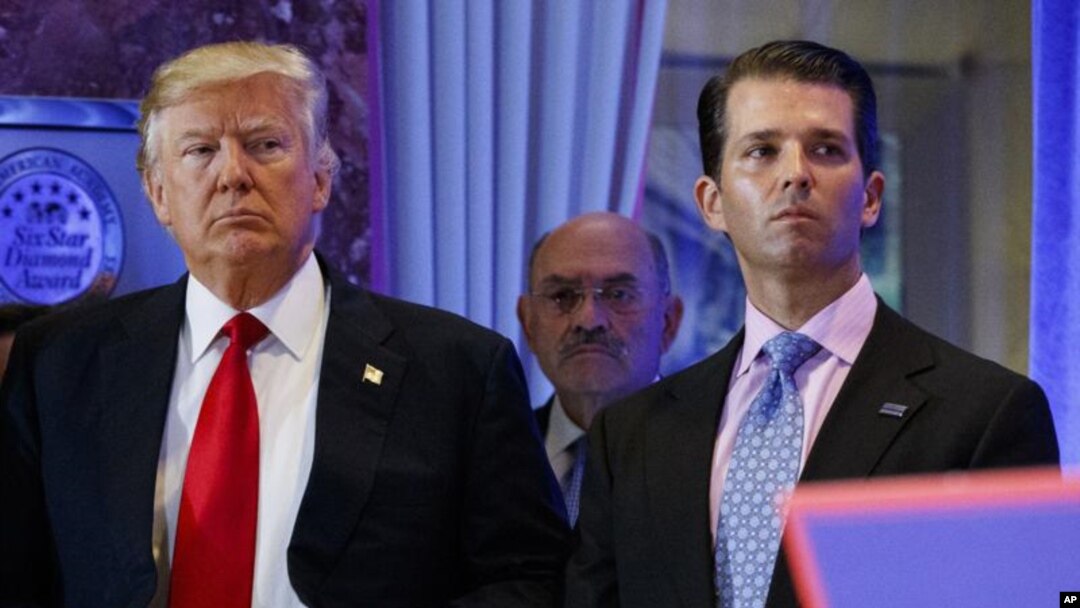 FILE - In this Jan. 11, 2017, shows President-elect Donald Trump, left, his chief financial officer Allen Weisselberg, center, and his son Donald Trump Jr., right, attend a news conference in the lobby of Trump Tower in New York. Manhattan prosecutors hav