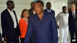 FILE - photo taken on March 20, 2016, Congo incumbent President Denis Sassou N'Guesso casts his ballot, at a polling station, in Brazzaville, Congo. A Republic of Congo opposition party has called for the unconditional release of political prisoners and easing of arbitrary arrests.