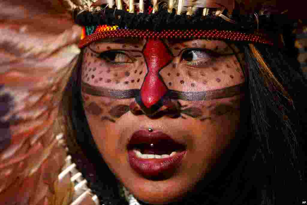 An Indigenous woman attends a march to protest the policies of Brazilian President Jair Bolsonaro and in favor of women&#39;s rights and the demarcation of Indigenous lands in Brasilia, Brazil.